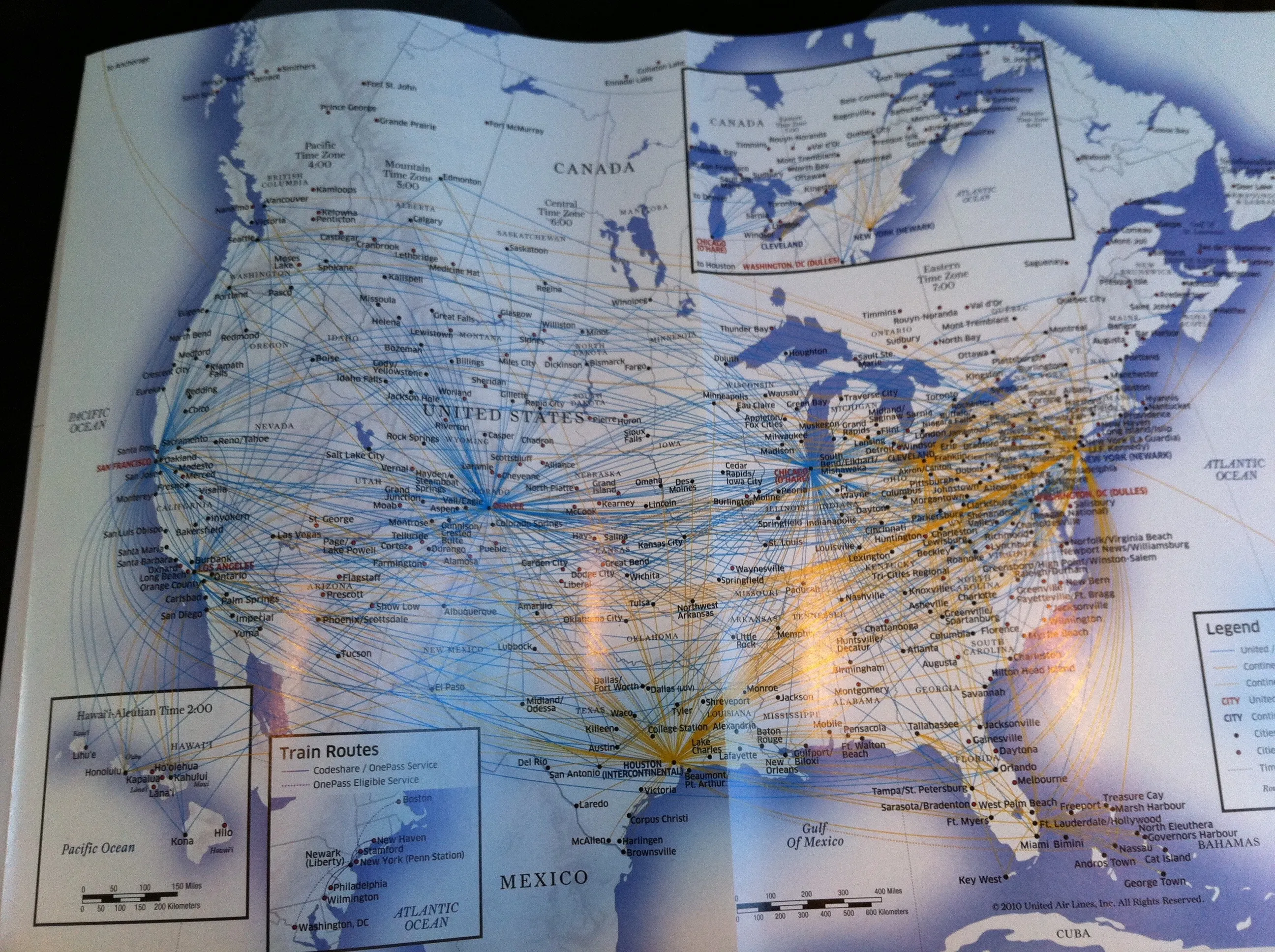 A photograph of the United and Continental Airlines flight route map from an in-flight magazine circa 2010.